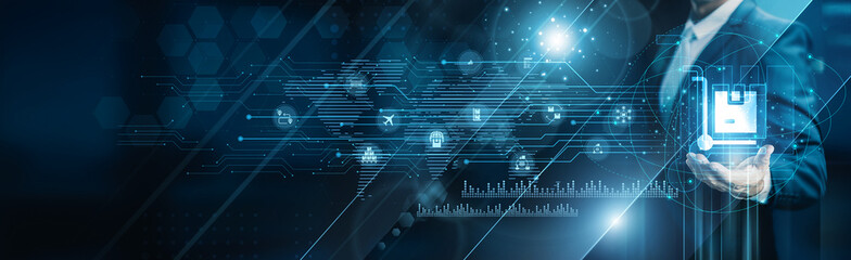 Businessman holding building of logistics operations, supply chain management inventory...