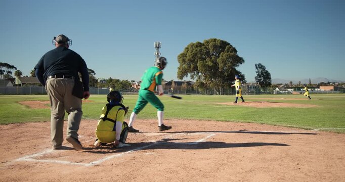 Pitcher winding up and releasing baseball, batter swinging racing to first base as umpire signaling