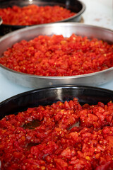 Grated tomatoes being prepared for winter storage in jars