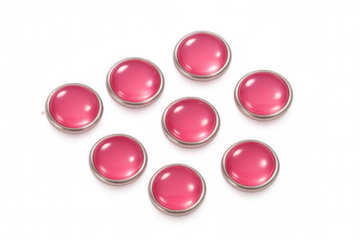 Metallic-edged pink sewing buttons lined precisely, showcasing glossy surfaces against transparent backdrop