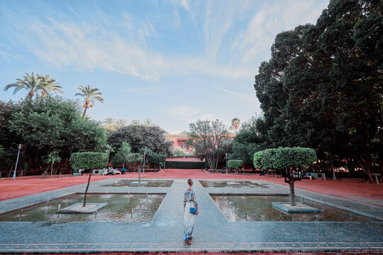 Young traveling woman walking on Marrakech park
