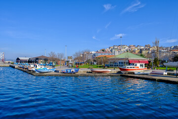 Fototapeta premium Bandirma, Turkey - February 7, 2024: Marina and embankment on sunny day