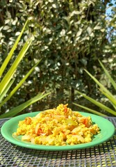 egg ragout made from fresh vegetables, green background
