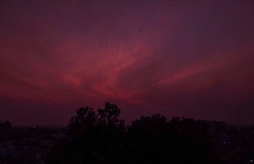 Beautiful sunset scenery view of colorful sky over the city background, nature photography, silhouette of trees, night sky wallpaper 