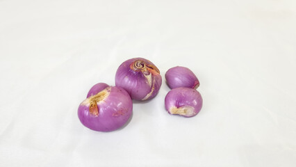 Red onion on white background. Cooking seasoning ingredients. Kitchen ingredients. Cuisine concept.