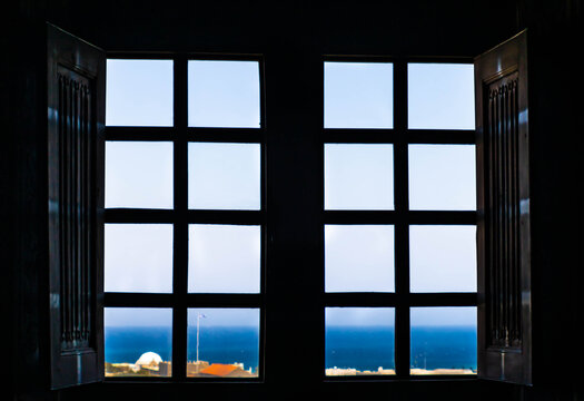 View at the Rhodes town and aegan sea photographed through window, Greece