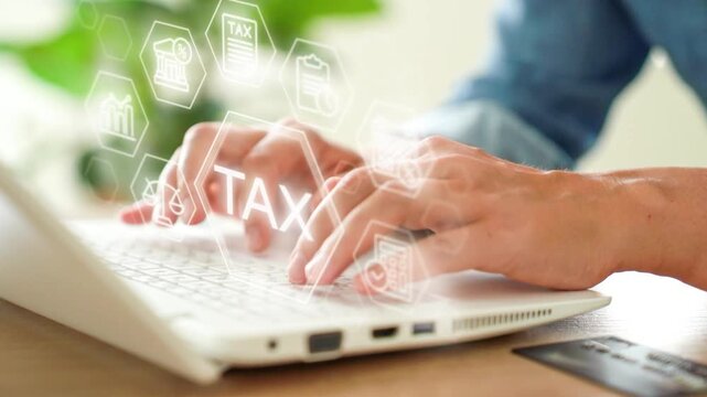 Tax concept - female hands tyling on laptop with tax overlay