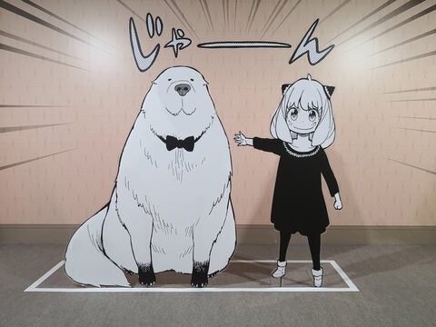 tokyo, tennozu isle - may 8 2025: Japanese standee featuring Anya Forger and its pet dog Bond from the popular manga and anime series SPY&times;FAMILY displayed at the JUMP PLUS 10th anniversary exhibition.