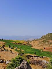 Scene in the High Tetouan Mountains, on the way to Mount Kelti Park, featuring views of mountains, peaks, and unspoiled landscapes. Each scene showcases the beauty of nature in its truest form.