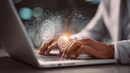 Digital transformation highlights innovation through hands typing on laptop with gears illustration overlay in a modern workspace