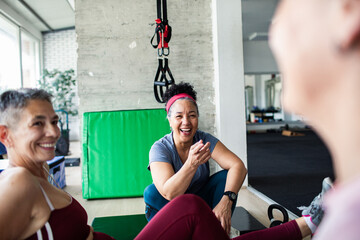 Senior woman talking to friend after gym workout