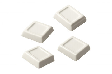 Four chunks of white chocolate are falling against a transparent background, perfect for compositing into food-related designs