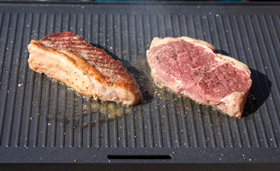 beef steak preparation on electric grill