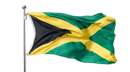 A jamaican flag waving on a silver pole against a black background in a patriotic display of national pride