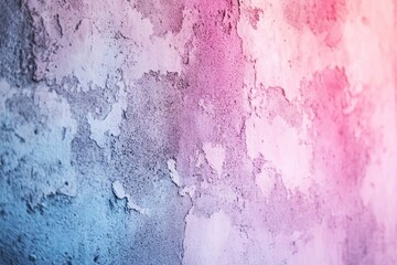 Textured wall with peeling paint, transitioning from blue to pink in a soft gradient, creating a dreamy, abstract effect.