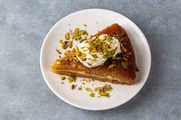 Turkish Traditional Dessert Ekmek Kadayif - Bread Pudding. Ramadan Dessert with cream