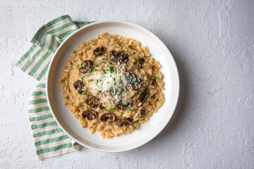Risotto with porcini and champignon mushrooms in plate