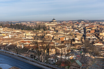 Cityscape panorama Toledo Spain: Capture a sweeping view of a historical city on a clear day, showcasing the unique architecture and cultural heritage of the region.