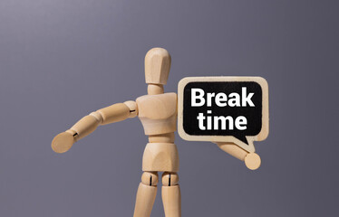 Break Time with wooden blocks alphabet letters and alarm clock