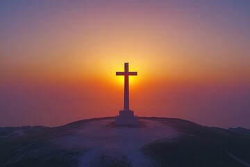 A cross stands on a hill silhouetted against a vibrant sunrise, symbolizing faith, hope, and spiritual reflection.