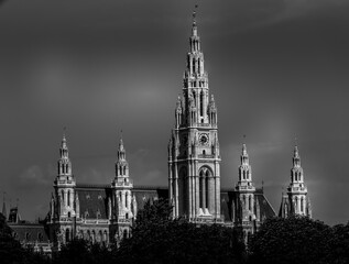Black and white moody image of a majestic church with tall spires in Europe.