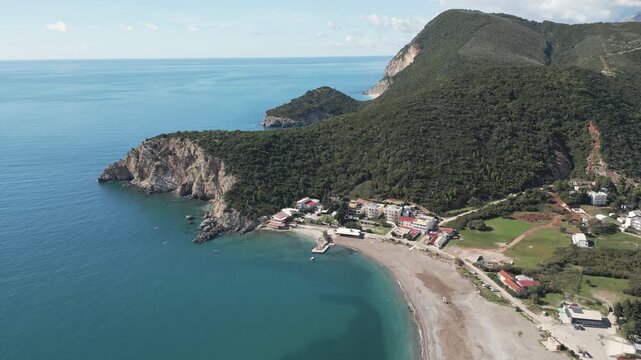 Aerial video showcase a long sandy beach in Canj, a coastal Adriatic town in Montenegro