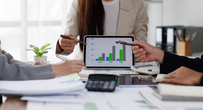 Business planning analyze investment and marketing analyzing data charts, graphs, and a dashboard on a laptop screen in the office.	