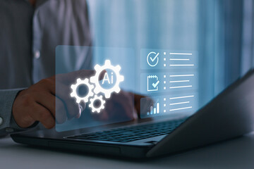 Businessman using AI technology on laptop for task automation, project planning and data analysis, symbolizing artificial intelligence, digital transformation and productivity in modern business.