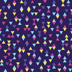 Seamless geometric pattern with shapes in triangular grid. Blue, yellow and purple triangles on dark violet background. Could be used as wallpaper, texture, print, fabric. 