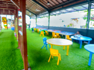 Blurry Colorful Children's Play Area with Tables and Chairs
