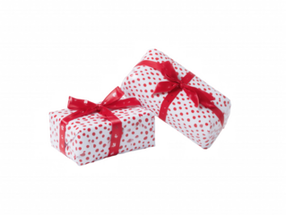 Two gift boxes with red and white polka-dot pattern and red ribbons on transparent background