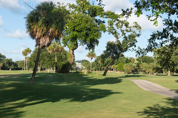 Isle of Palms, South Carolina, USA &acirc;&euro; June 30, 2025: Lush golf course landscape at Wild Dunes Resort with palm trees and a distant clubhouse under a bright summer sky.