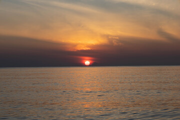 Beautiful sunset on the sea beach with coconut tree for travel in holiday