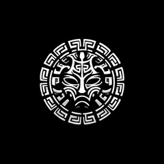 Intricate white tribal mask surrounded by geometric pattern on a stark black background
