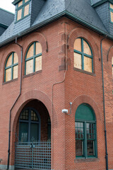 Historic Red Brick Building with boarded up windows