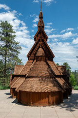 Traditional Wooden Church with Steeple and Shingled Roof