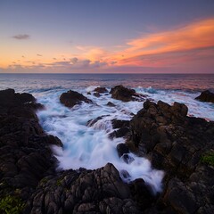 Fototapeta premium Ocean Waves Crashing on Dark Volcanic Rocks at Sunset