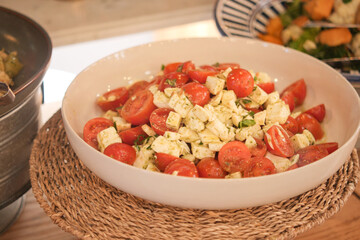 Fresh tomato and cheese salad served at a summer gathering