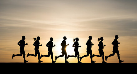 Fototapeta premium Silhouette Group Running Against Warm Sunset Sky