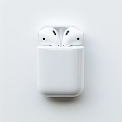 White wireless earbuds in charging case, top view