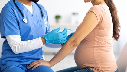 Nurse giving vaccine injection to pregnant woman.