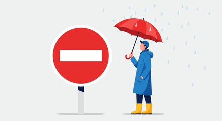 Person With Umbrella Stands Near A Road Sign On A Rainy Day