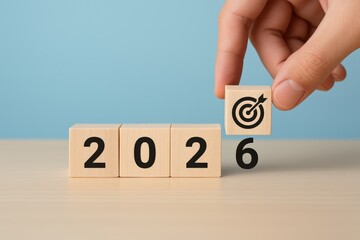 Wooden blocks showing the year 2026 with a target icon.