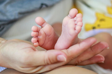 Pictures of foot of baby boy with concept photos of infant children moments.