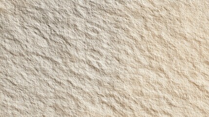 Close up of a rough textured light beige stone surface with natural patterns and variations