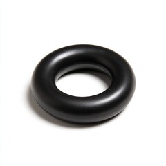 A black rubber band is sitting on a white background