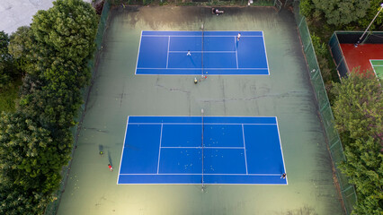Aerial View of Illuminated Tennis Courts at Dusk Outdoor Sports Facility