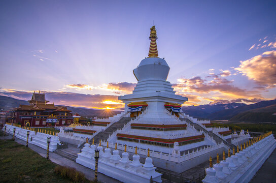 Sunrise Illuminating Ancient Tibetan Buddhist Pagoda In Sichuan Scenic Highlands Of China