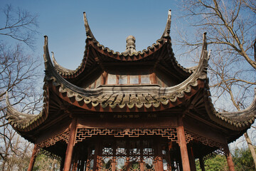 Discovering the intricate roof design of a serene traditional Chinese temple