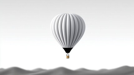 White hot air balloon soaring over soft, gray mountains under a serene sky.